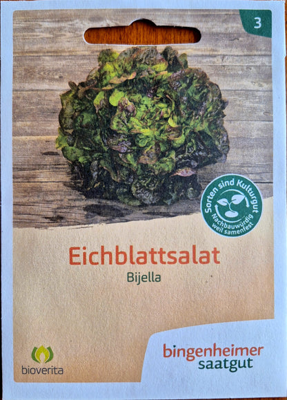 Saatgutpackung Vorderseite: Verpackung des Eichblattsalats 'Bijella' mit Bild der reifen Pflanze.