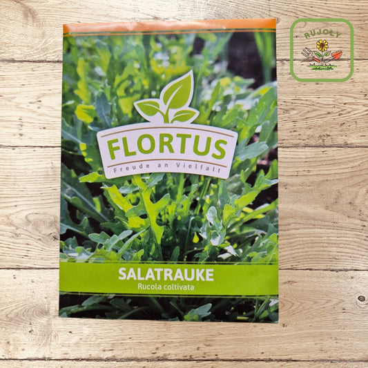 Vorderseite der FLORTUS-Saatguttüte Salatrauke mit grünen Rucolablättern und FLORTUS-Logo.