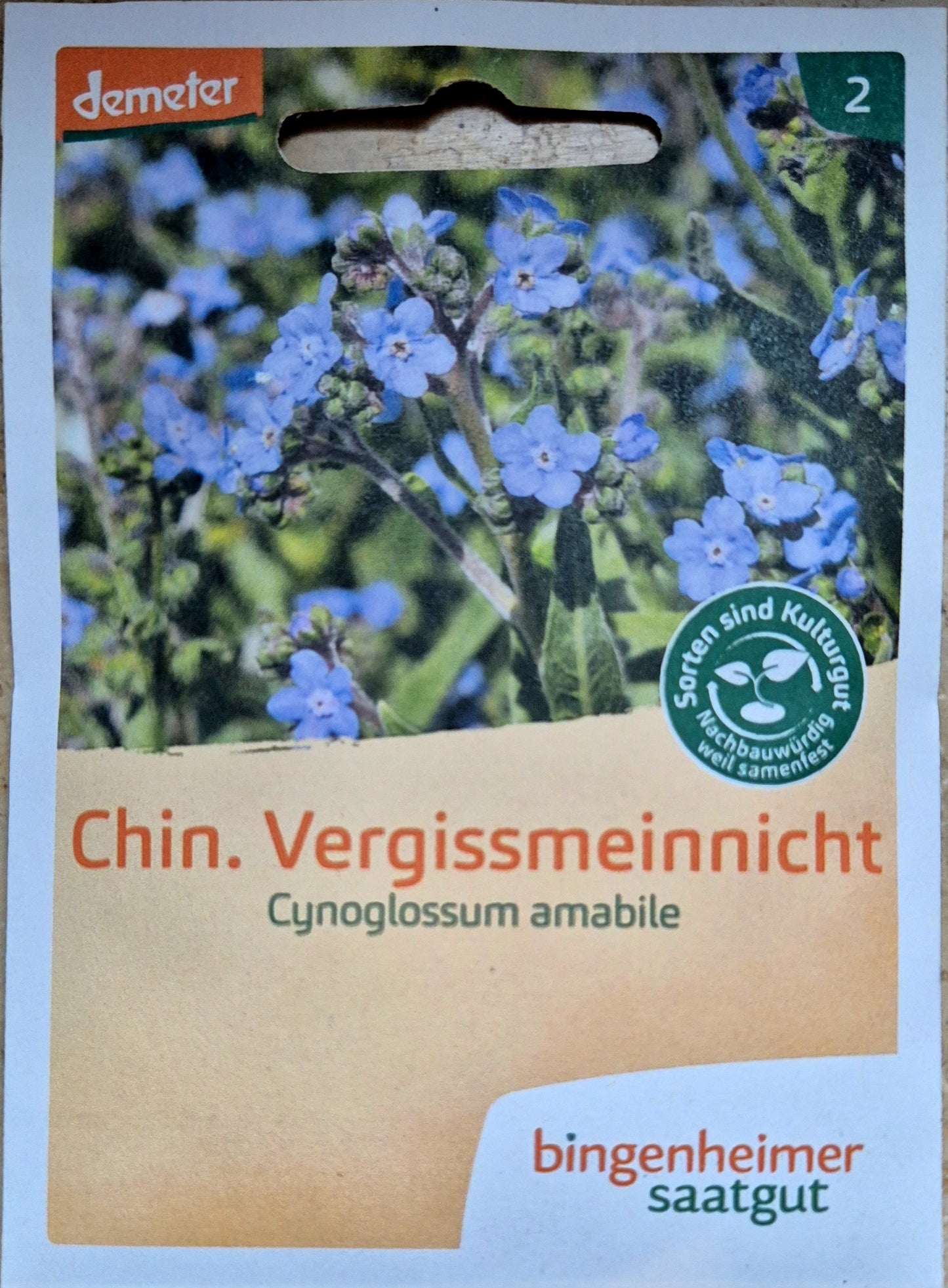 Vorderseite der Saatgutverpackung von Bingenheimer Saatgut mit blühendem Chinesischen Vergissmeinnicht.