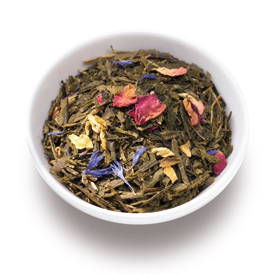 Ronnefeldt Morgentau® Teemischung mit Blüten und Kornblumen neben einer weißen Schale